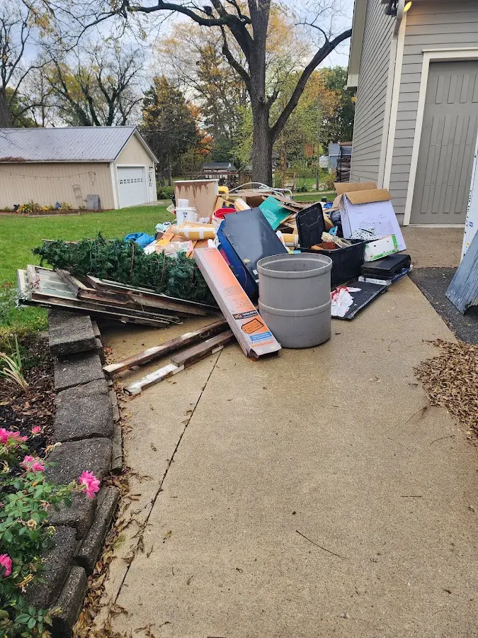 Dumpster being loaded with debris for Commercial Dumpster Rental in Mount Pleasant